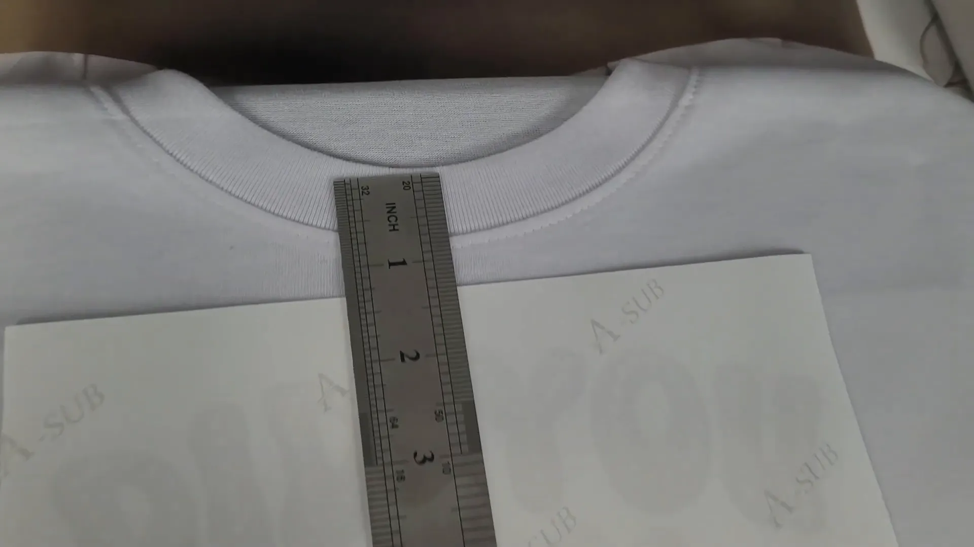 Placing design on shirt for heat pressing